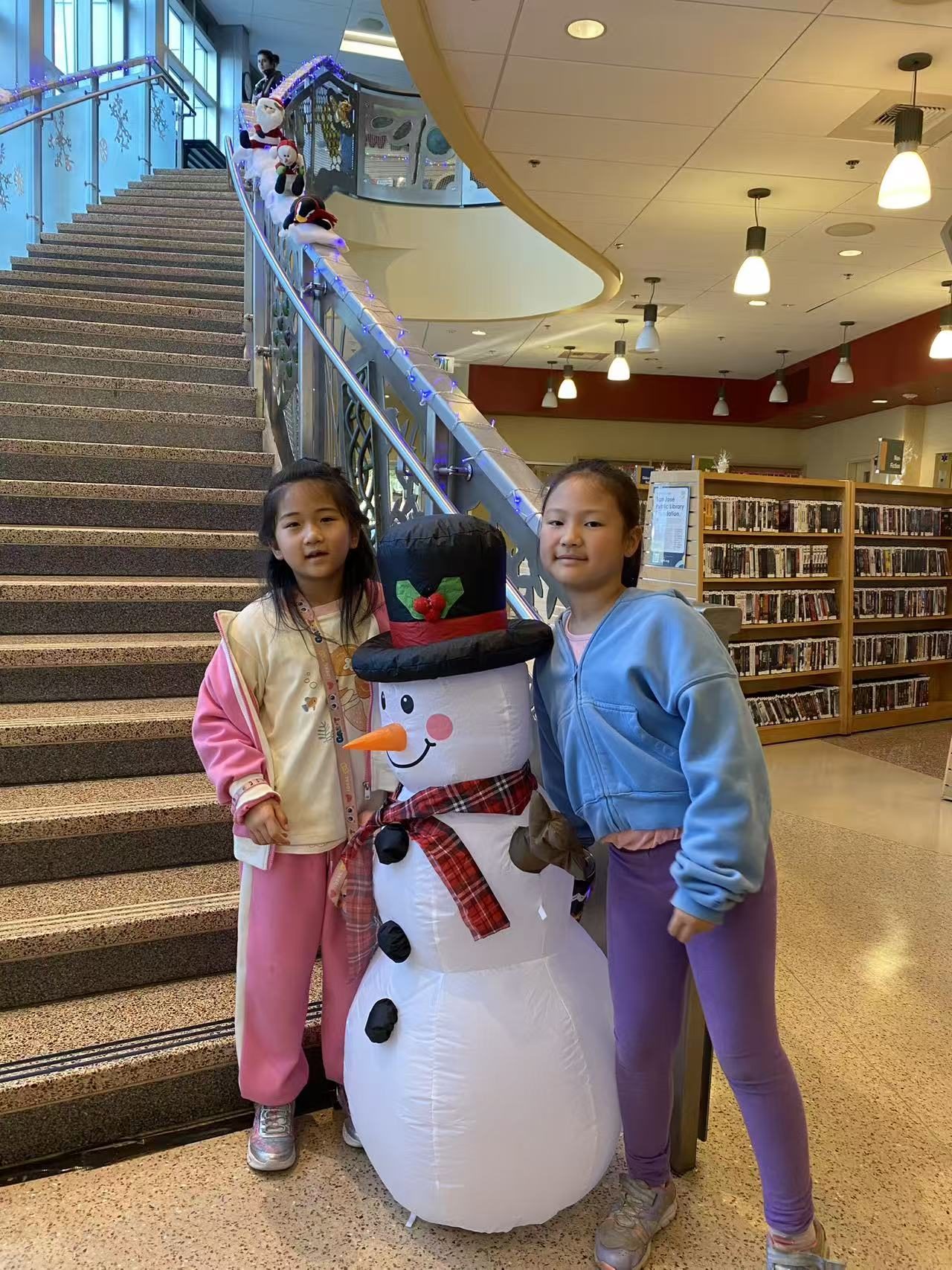 Students with a snowman display during a winter outing