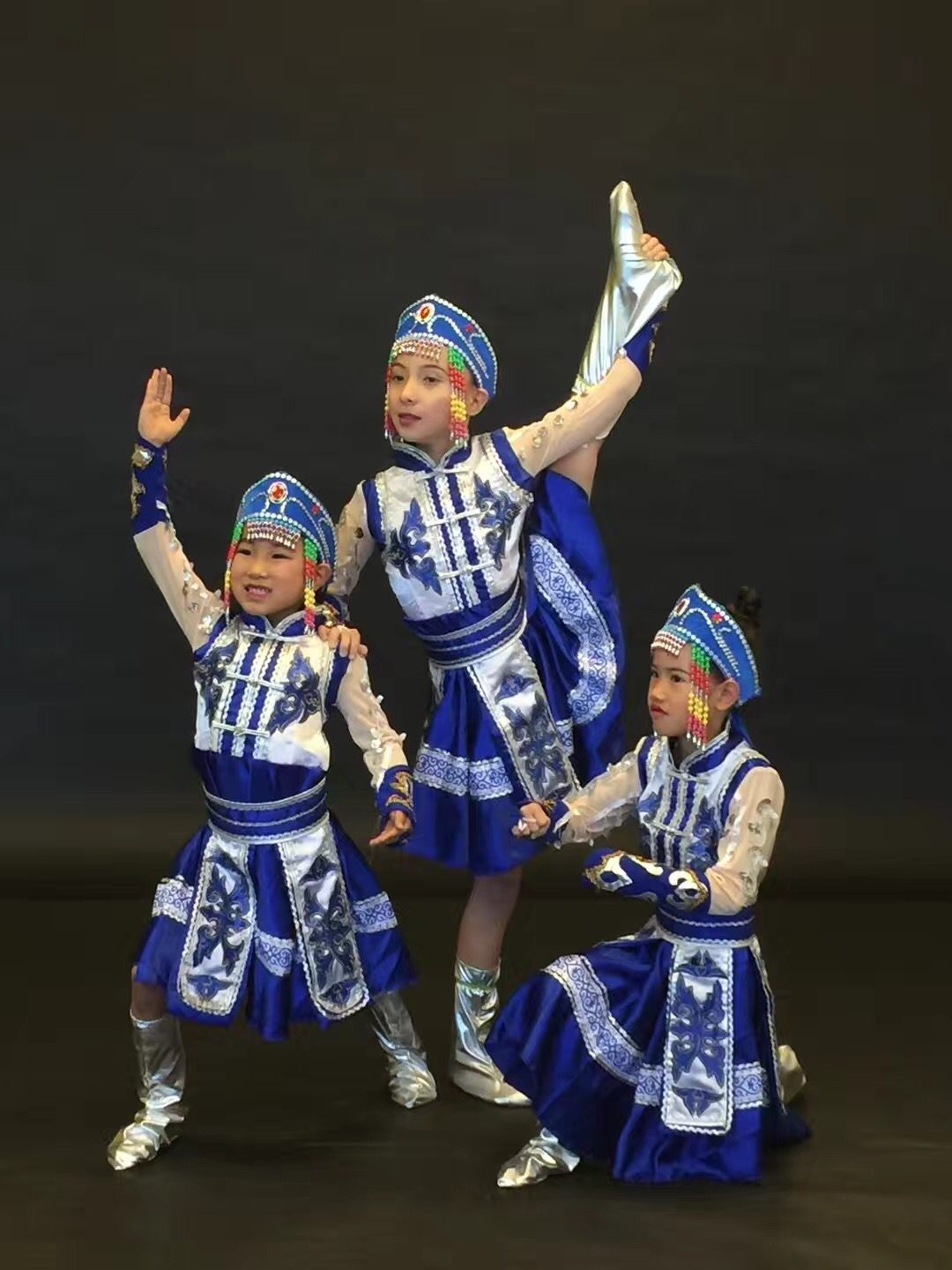 The dance group finishing their performance together