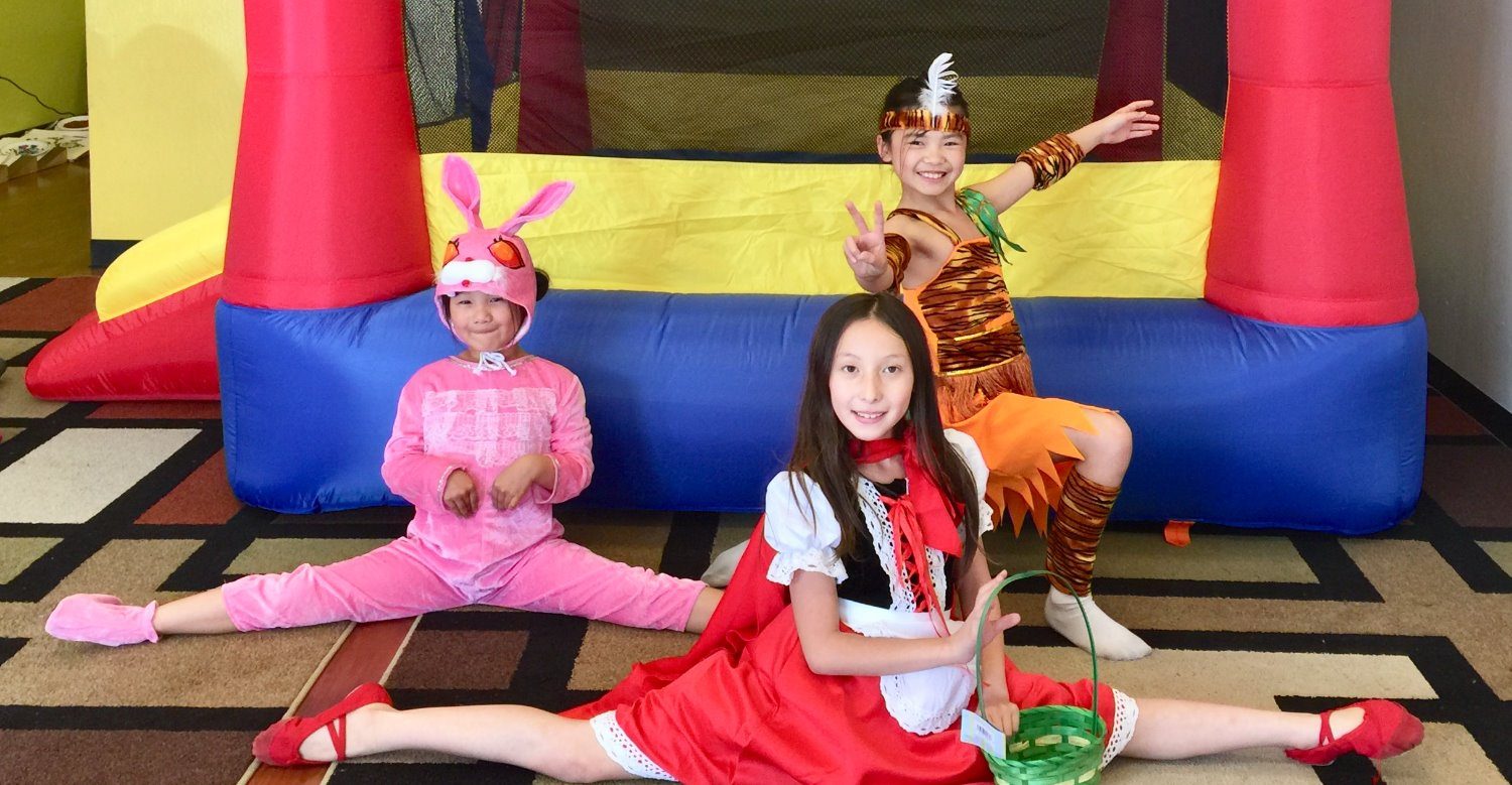 Children doing an outdoor science activity together at summer camp